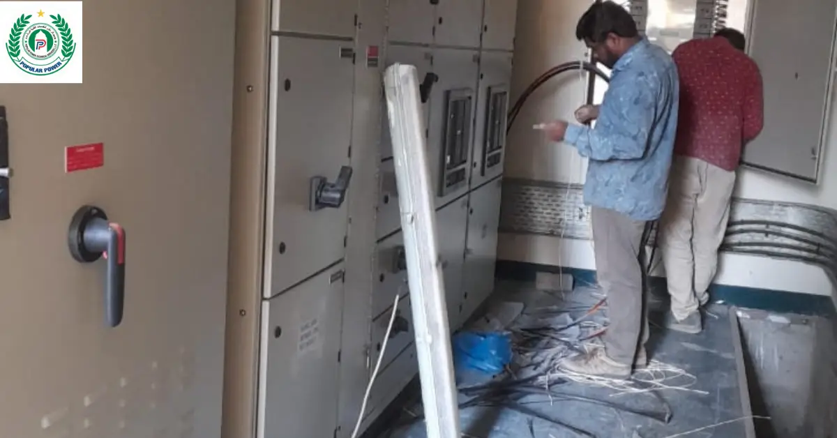 Electrical technicians wiring an industrial control panel - PPTS Electrical Service in Dubai