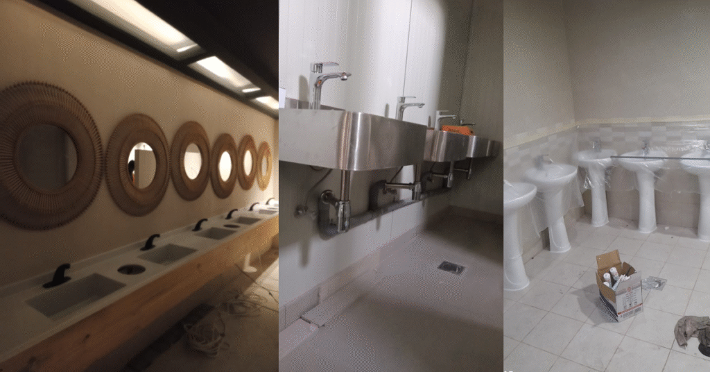 "Modern restroom sink installation with multiple black faucets and round decorative mirrors – plumbing service by PPTS in UAE"