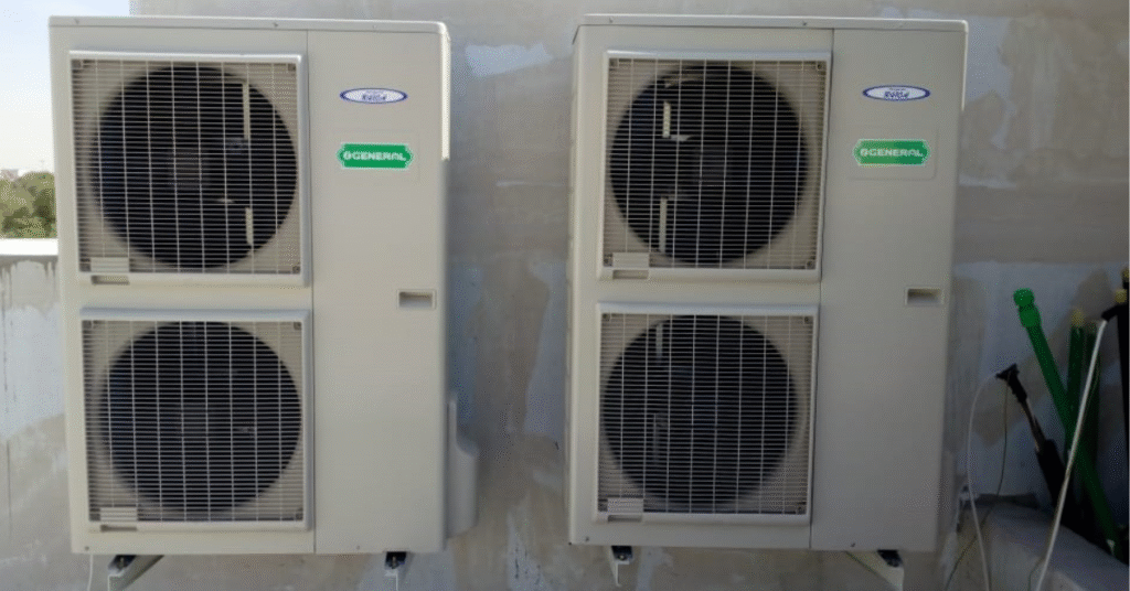 Same Day AC Repair Sharjah & Dubai – Outdoor AC compressor units installed by HVAC professionals.