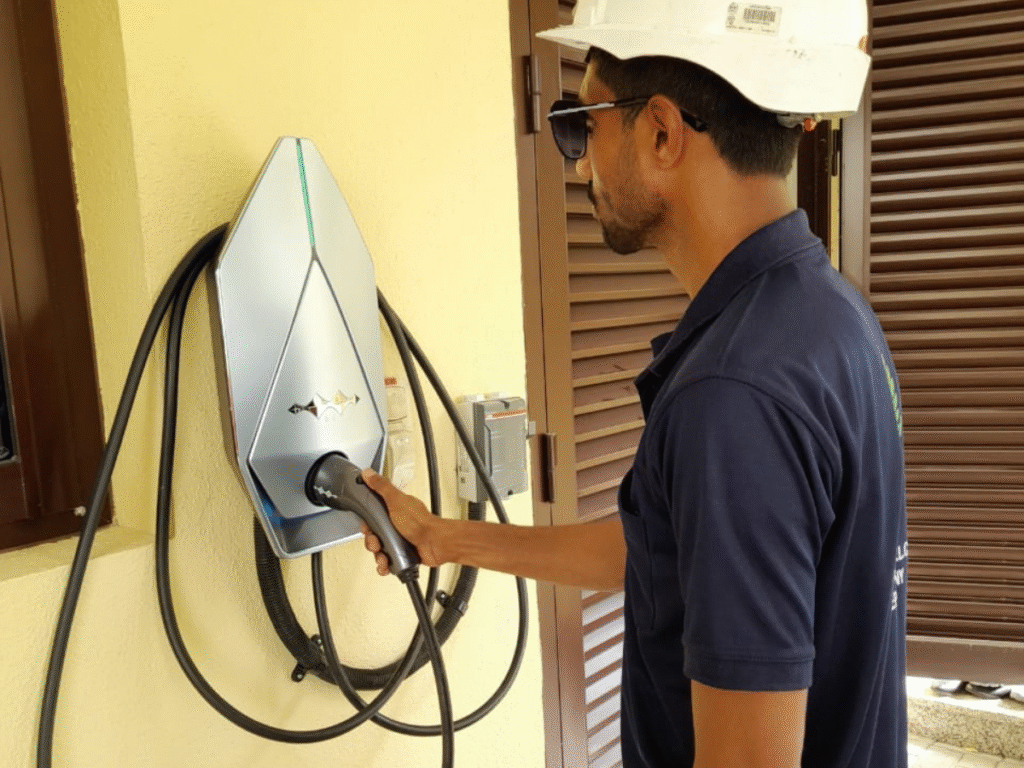 EV charger installation at home in UAE, showing wall-mounted electric vehicle charging station in residential garage